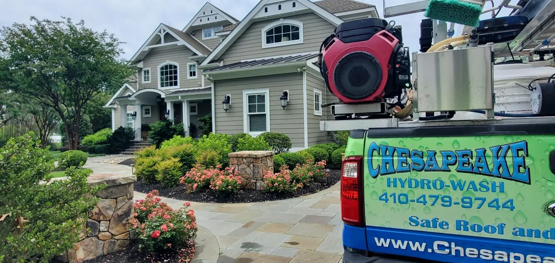 Chesapeake Hydro-Wash truck and home during gutter cleaning service in Maryland and Delaware