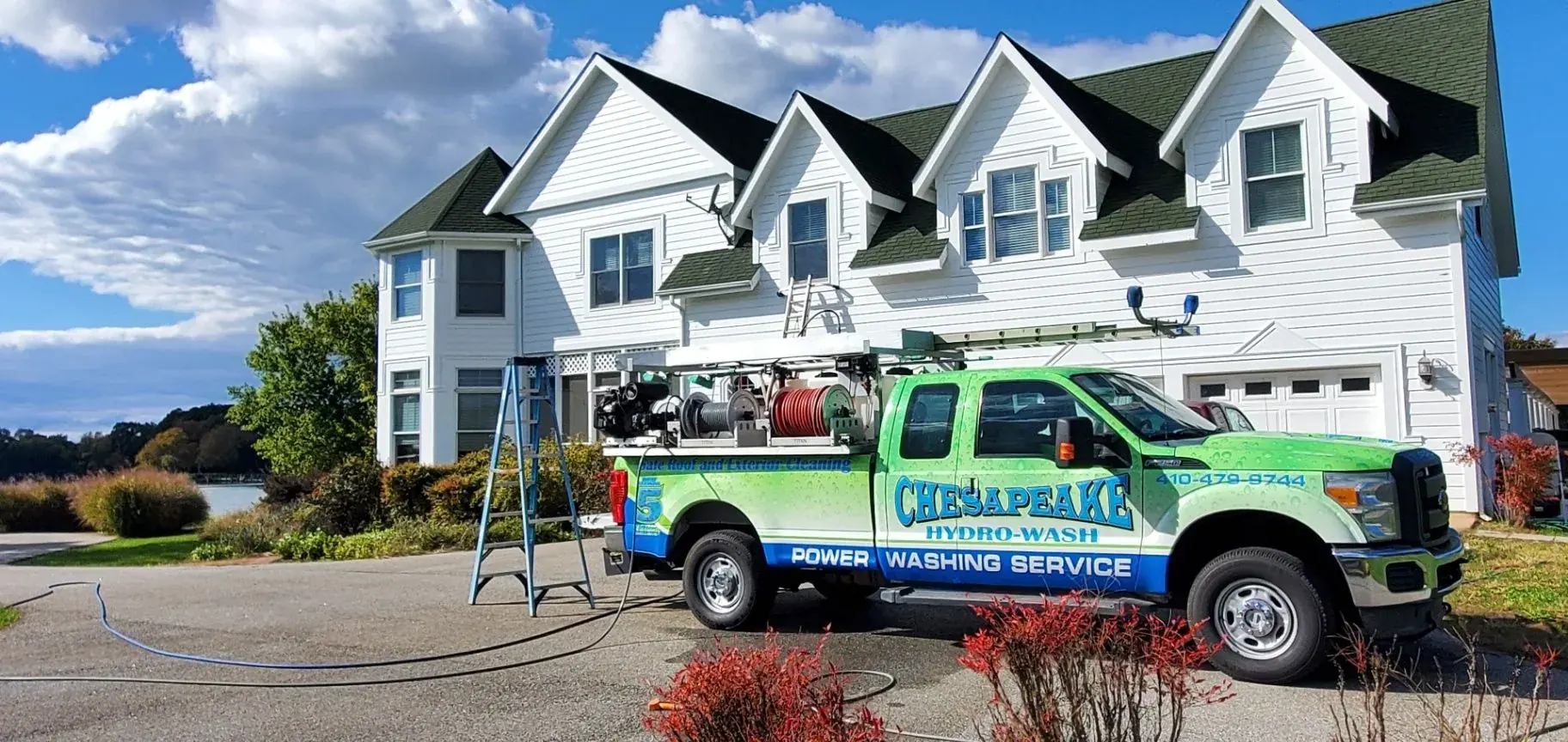Chesapeake Hydro-Wash truck and house during power washing in Maryland and Delaware